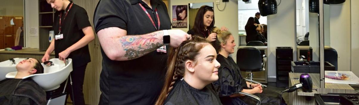 WMC Women's Hairdressing Level 2 students working inside classroom