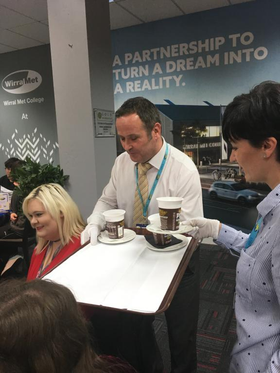 Wirral Met staff member serving homemade pot noodles to people at the Student Celebratory Lunch 2017