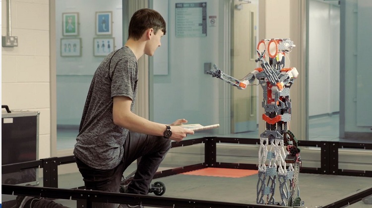 Wirral Met robotics student working with robot in robotics classroom within Stem Centre