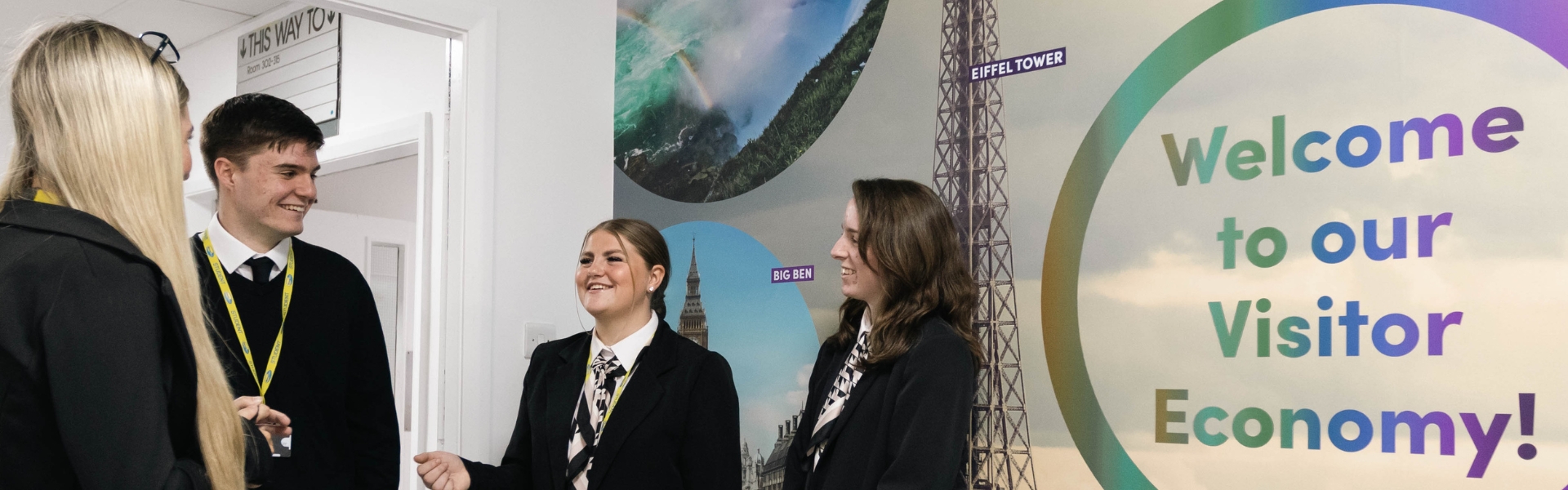 Travel, Tourism and Aviation students standing inside corridor at the Conway Park campus